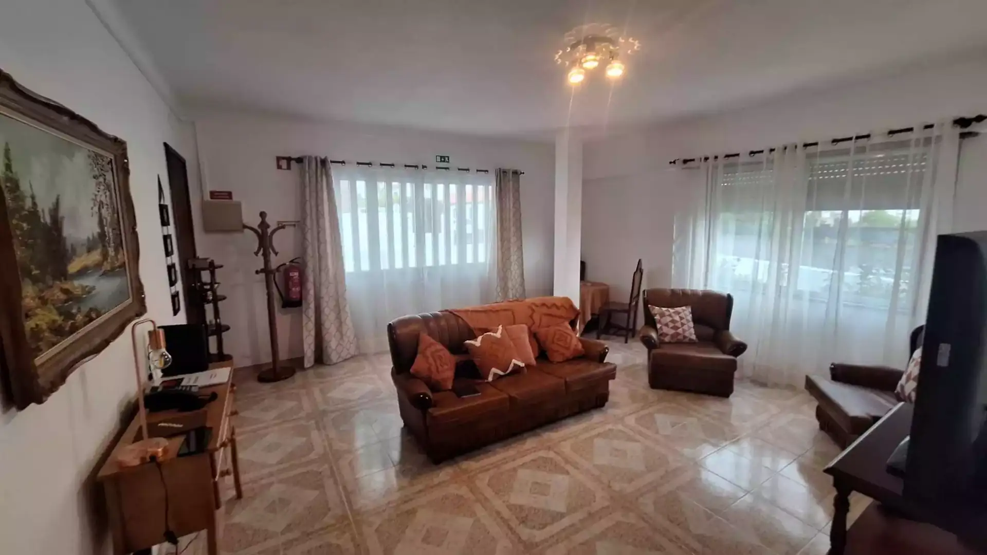 Living room seating area at Cantinho das Japoneiras