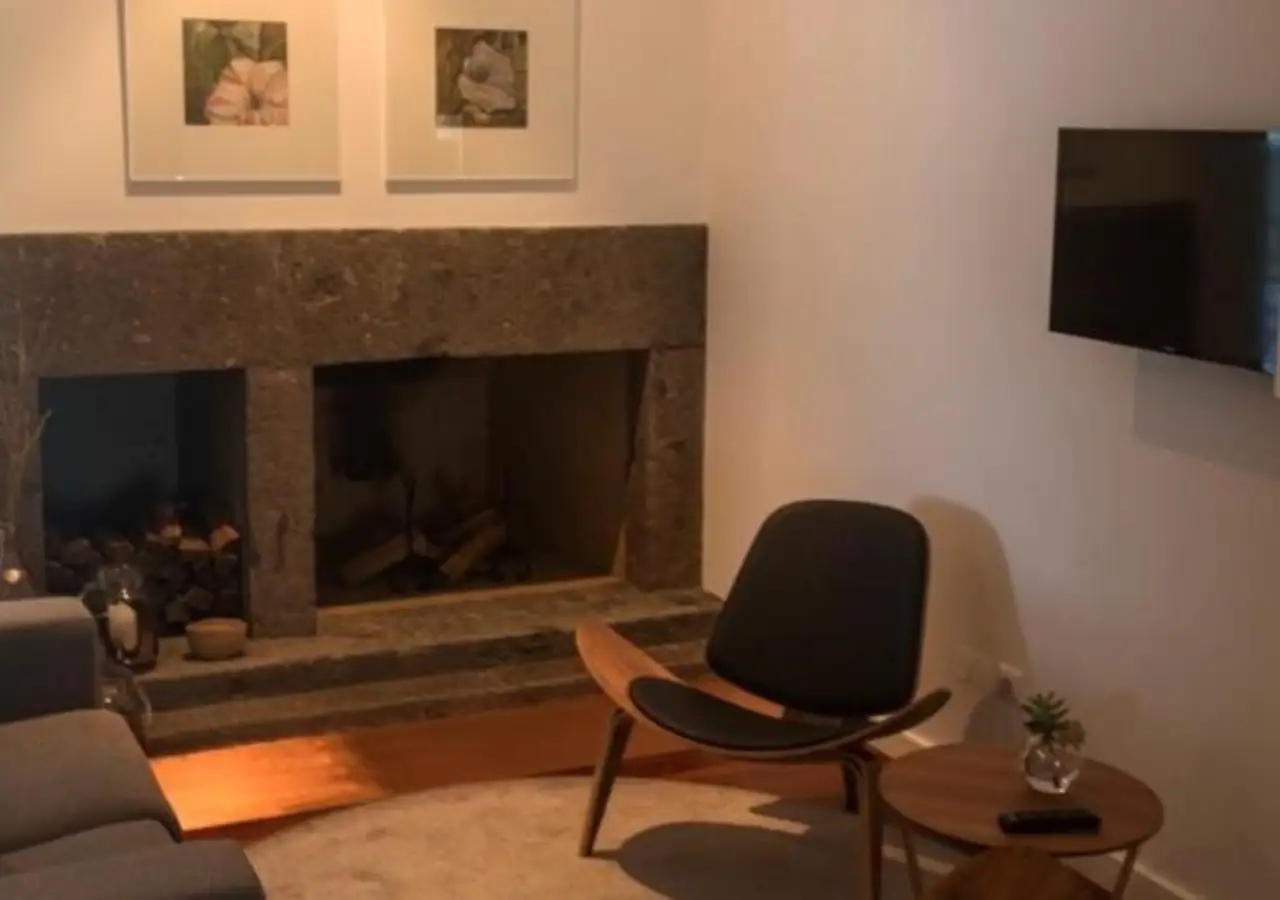 Living room with fireplace at Quinta do Jasmin Villa